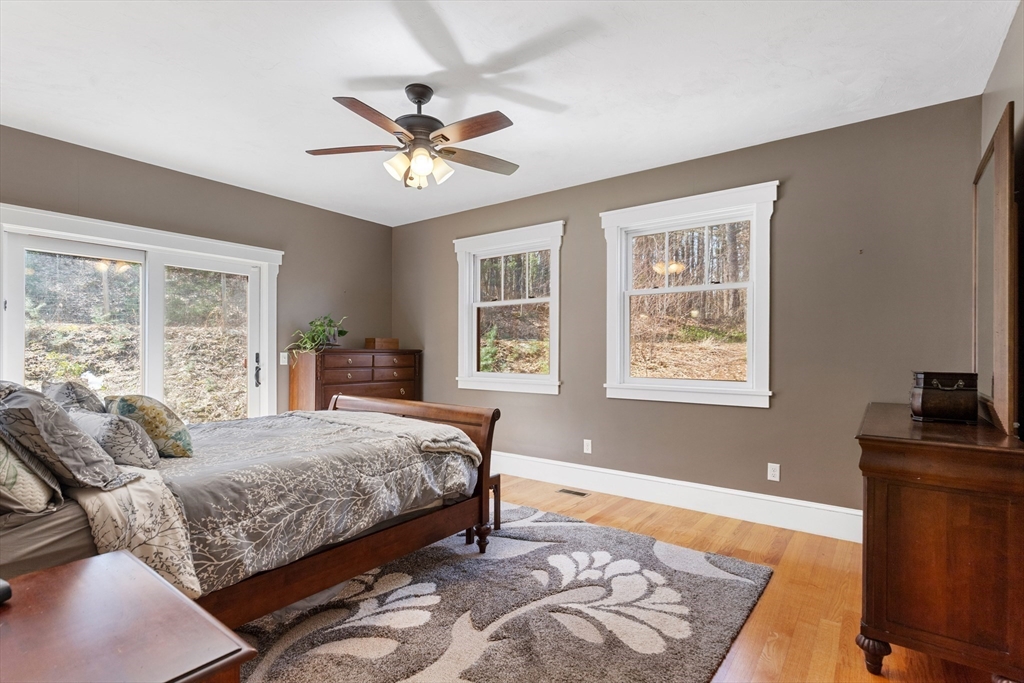 144 Brook Street Hudson, MA 01749 - Photo 19 of 44 a bedroom with a bed and a window