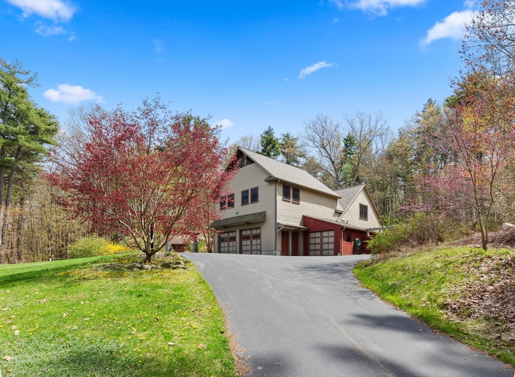 144 Brook Street Hudson, MA 01749 - Photo 2 of 44 a view of house with a yard