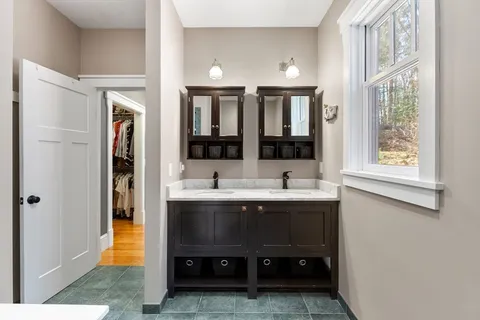 a view of bathroom with dual sinks