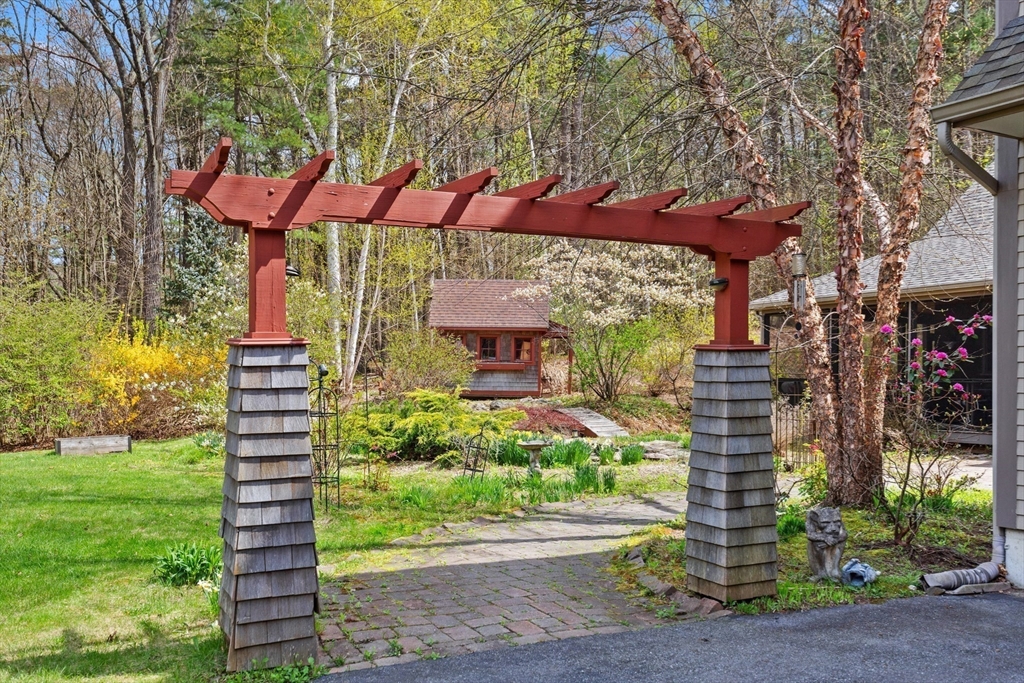 144 Brook Street Hudson, MA 01749 - Photo 33 of 44 a front view of a building with garden