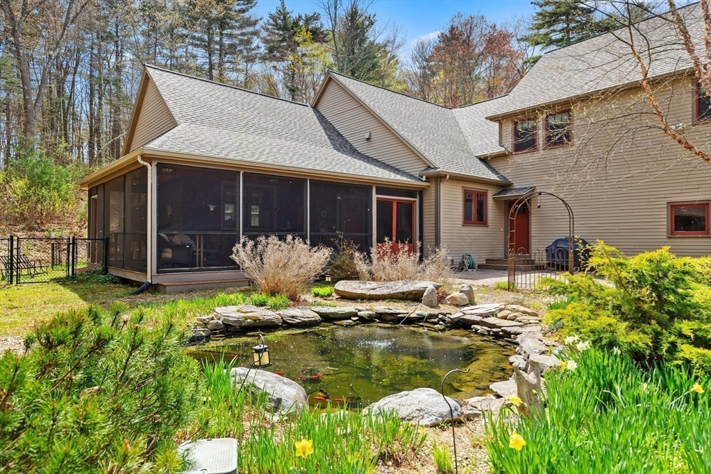 144 Brook Street Hudson, MA 01749 - Photo 34 of 44 a front view of a house with swimming pool