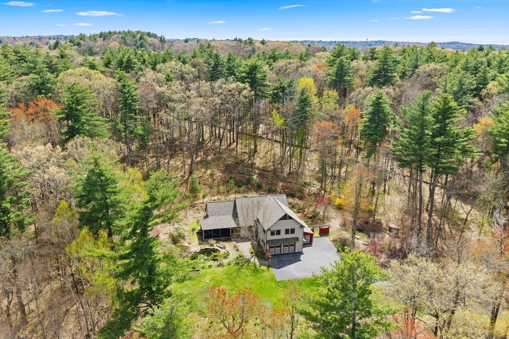 144 Brook Street Hudson, MA 01749 - Photo 37 of 44 a view of a city with lush green forest