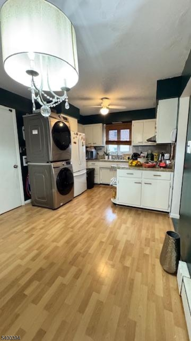 46 Guenther Place Passaic, NJ 07055 - Photo 2 of 10 a kitchen with a stove a refrigerator and a stove