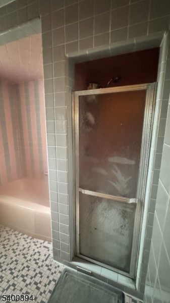 46 Guenther Place Passaic, NJ 07055 - Photo 7 of 10 a bathroom with a glass shower door