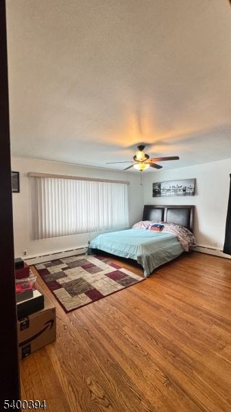 46 Guenther Place Passaic, NJ 07055 - Photo 9 of 10 a bedroom with a bed and a window