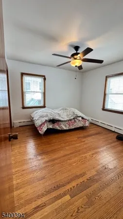 a bedroom with a bed and a view of room