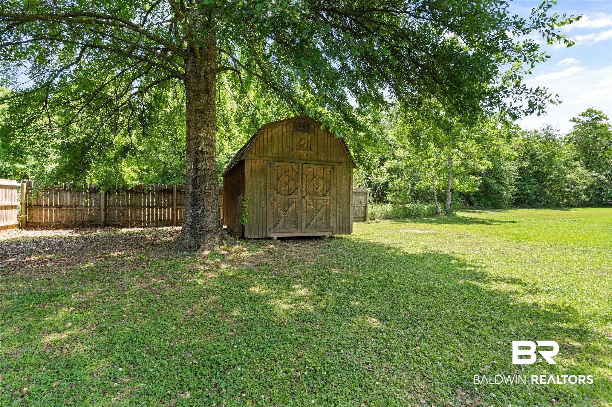 1411 Creola Axis Loop Road North Axis, AL 36505 - Photo 17 of 21 View of yard featuring a storage unit and an outbuilding
