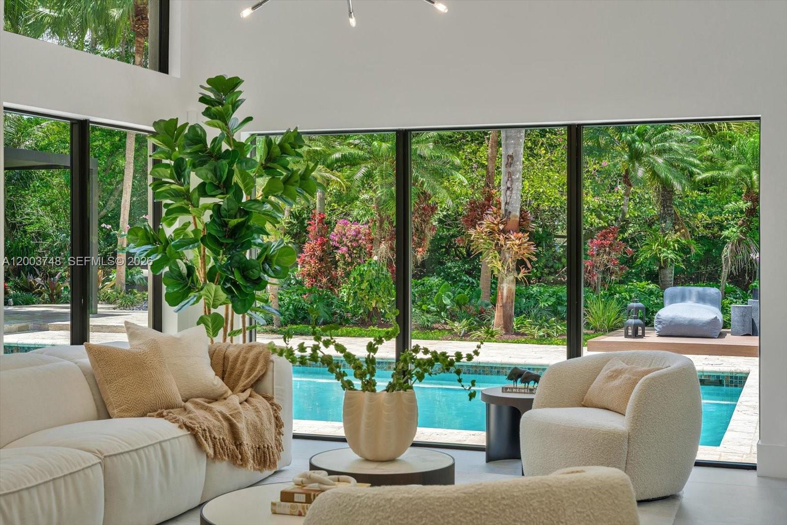 2675 Hackney Road Weston, FL 33331 - Photo 9 of 61 a living room with patio furniture and garden view