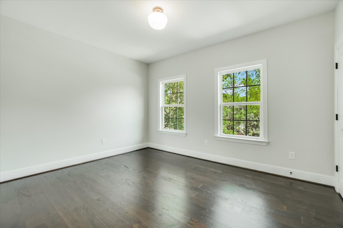 5200 Avenue H Austin, TX 78751 - Photo 11 of 20 an empty room with wooden floor and windows