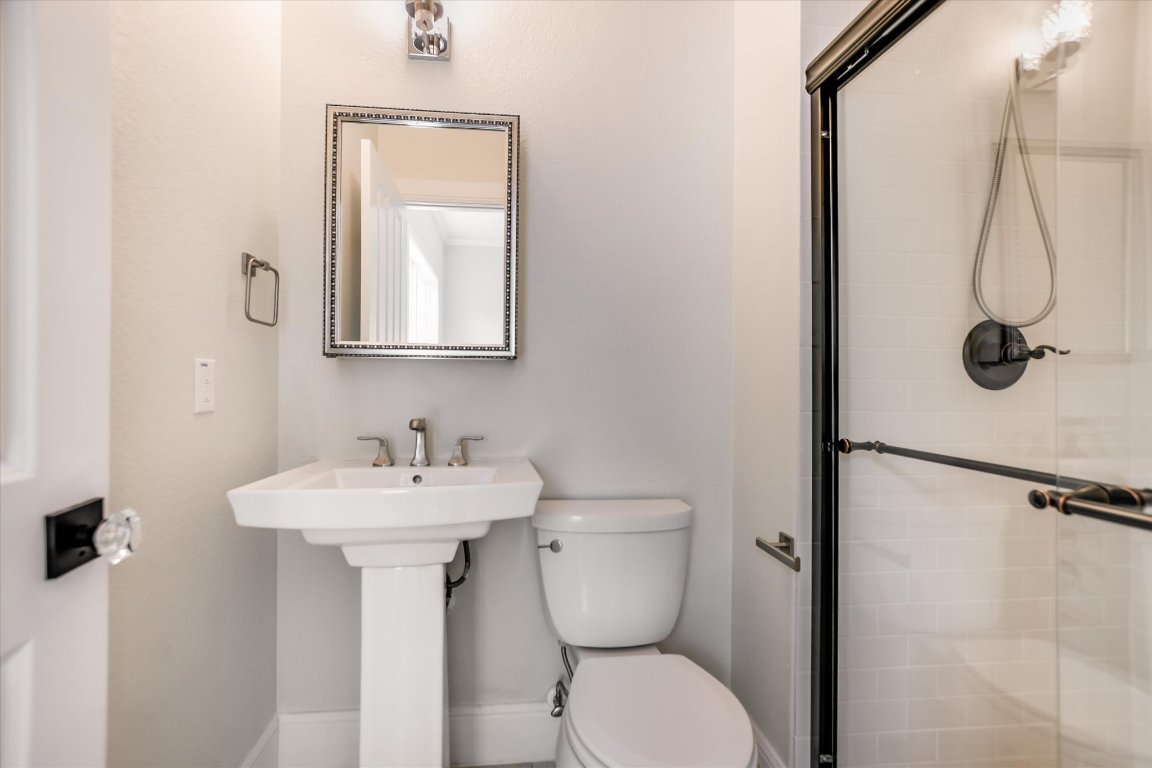 5200 Avenue H Austin, TX 78751 - Photo 8 of 20 a bathroom with a sink mirror toilet and shower