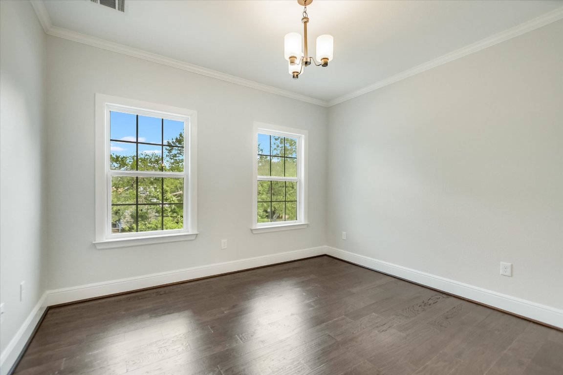 5200 Avenue H Austin, TX 78751 - Photo 9 of 20 an empty room with wooden floor and windows