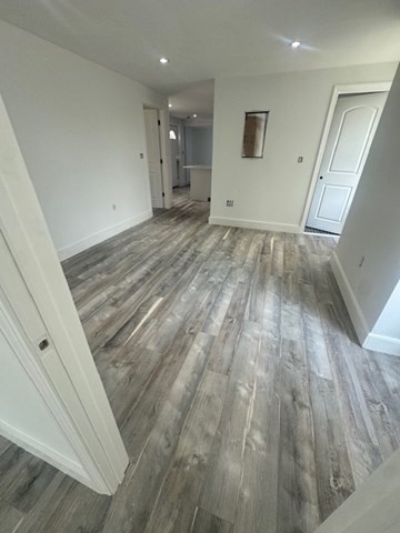 252 East Eagle Street, Unit 2 Boston, MA 02128 - Photo 9 of 11 a view of empty room with wooden floor