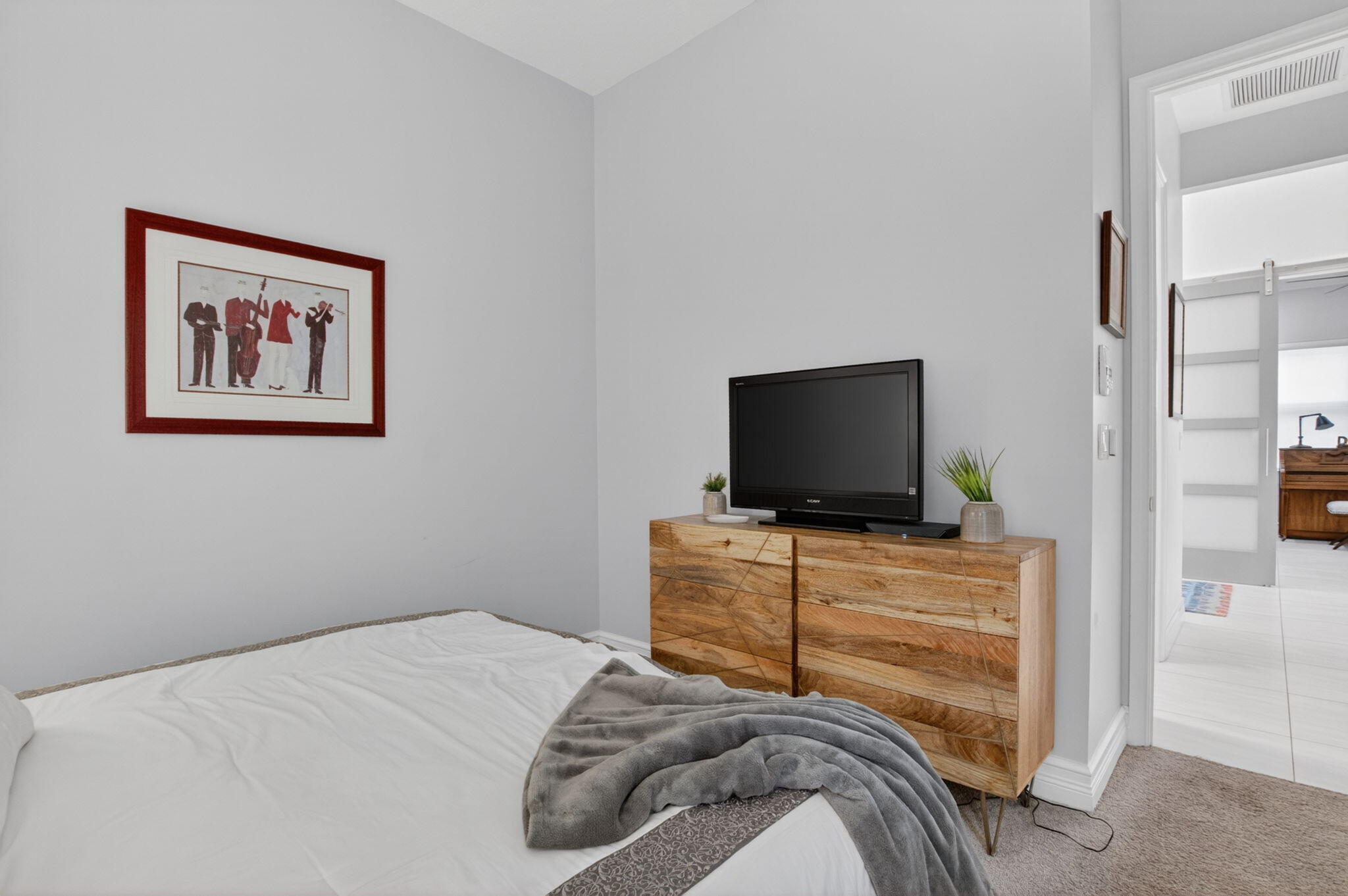 8263 Arabian Range Road Boynton Beach, FL 33473 - Photo 37 of 52 a bedroom with a bed and a flat screen tv
