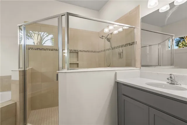 a bathroom with a shower and a sink