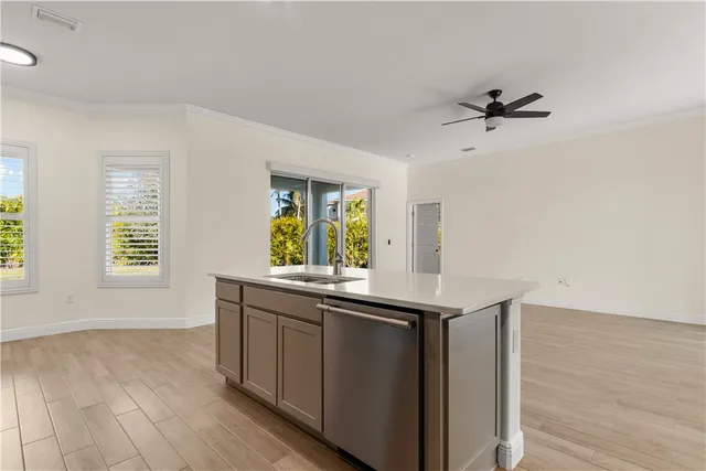 a kitchen with a sink and a window