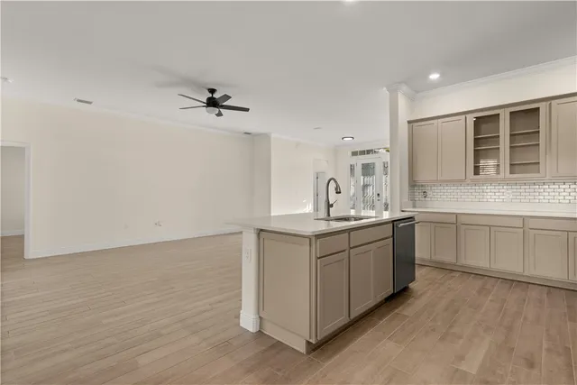 a kitchen with a sink cabinets and window