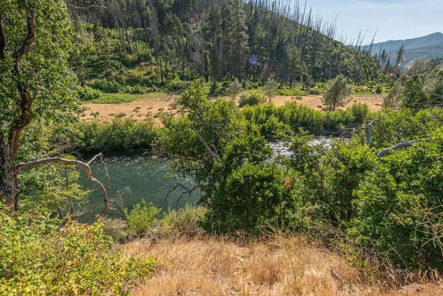 a view of a lake with top of house