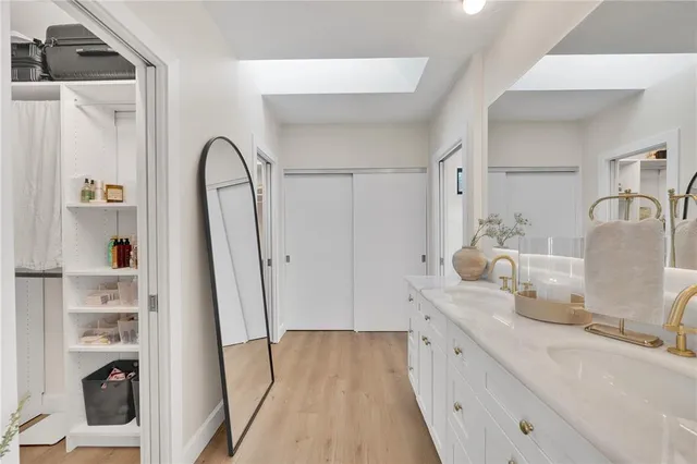 a bath tub sitting next to a window