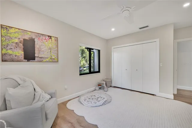 a spacious bathroom with a double vanity sink and a mirror