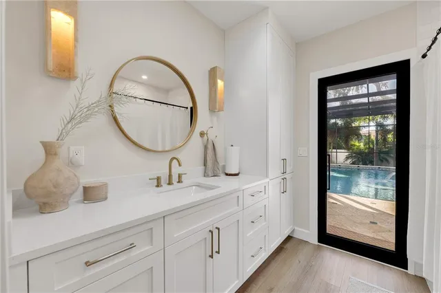 a living room with furniture a floor to ceiling window and a flat screen tv