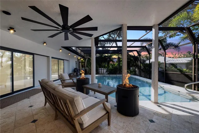 a view of a house with a yard and potted plants