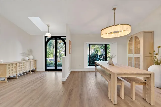 a view of a livingroom with furniture window and wooden floor