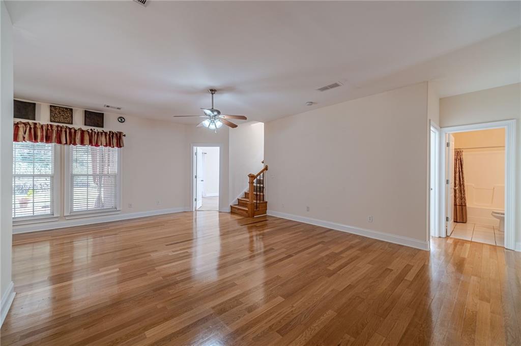 654 Huntington Trace Winder, GA 30680 - Photo 20 of 51 a view of empty room with wooden floor