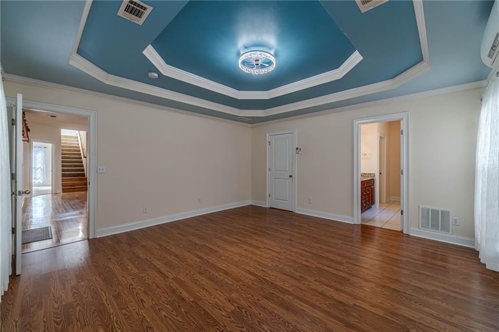 654 Huntington Trace Winder, GA 30680 - Photo 21 of 51 a view of an empty room and wooden floor