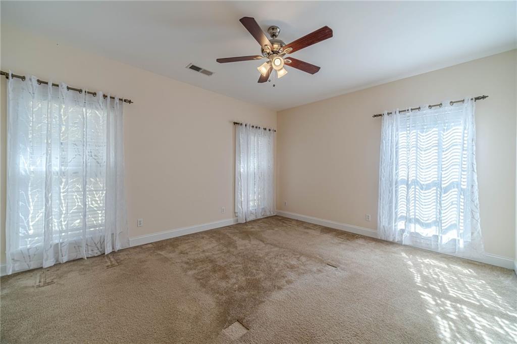 654 Huntington Trace Winder, GA 30680 - Photo 40 of 51 a view of an empty room with a window