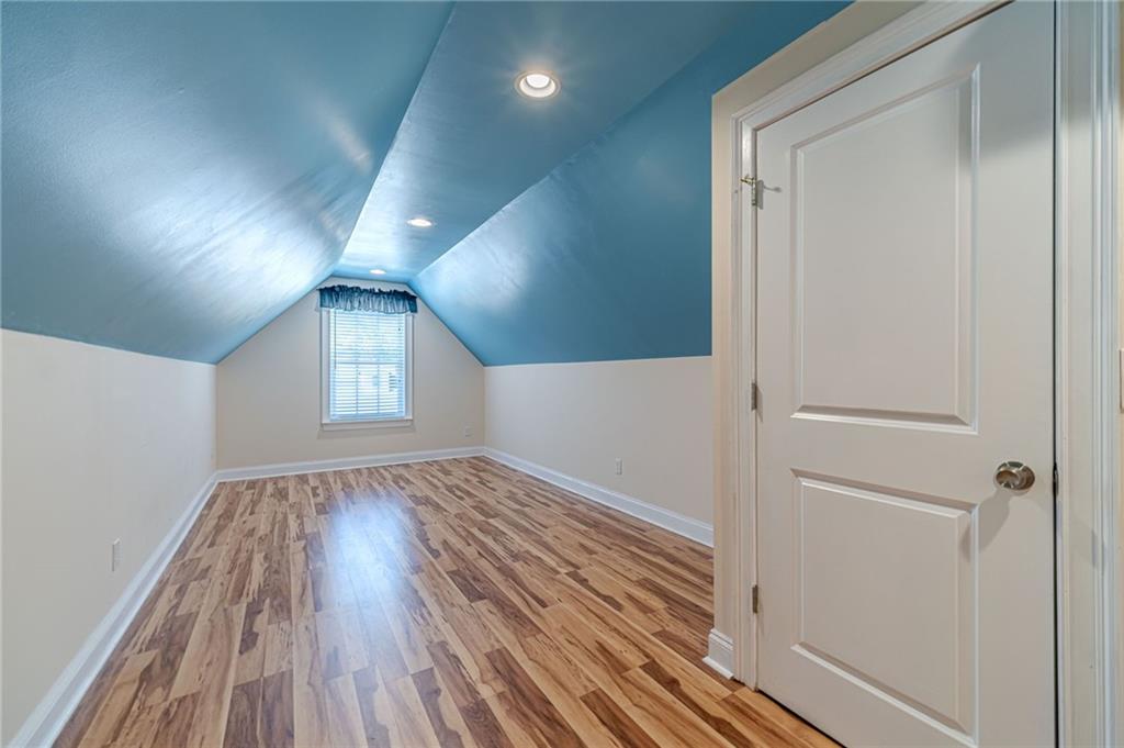 654 Huntington Trace Winder, GA 30680 - Photo 42 of 51 wooden floor in an empty room with a window