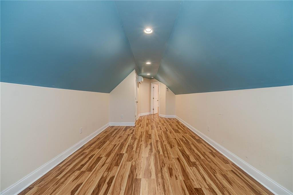 654 Huntington Trace Winder, GA 30680 - Photo 43 of 51 a view of empty room with wooden floor