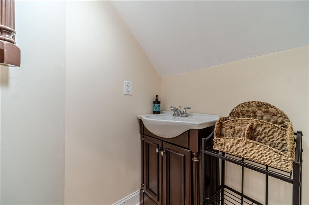 654 Huntington Trace Winder, GA 30680 - Photo 44 of 51 a bathroom with a sink and a mirror