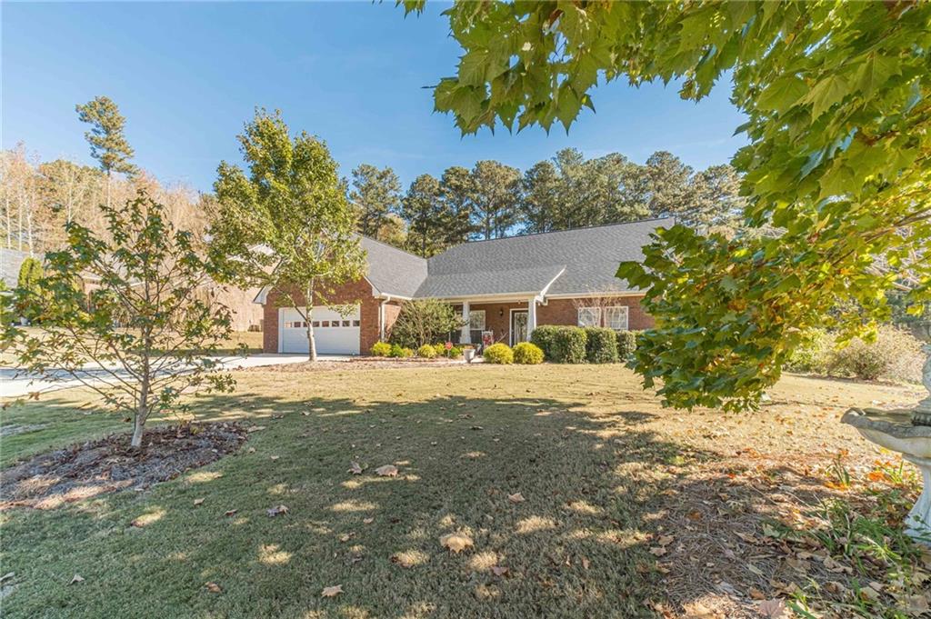 654 Huntington Trace Winder, GA 30680 - Photo 50 of 51 a front view of a house with a yard