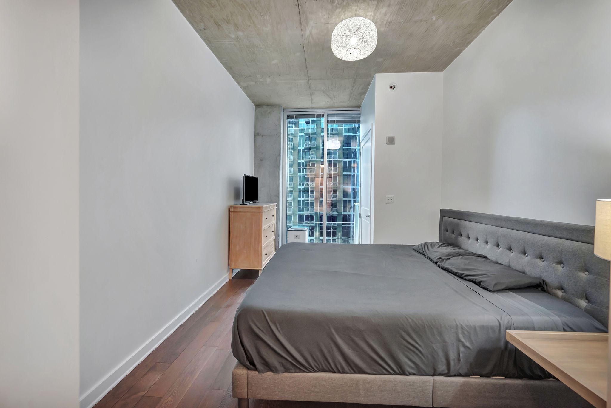 301 Demonbreun Street, Unit 1120 Nashville, TN 37201 - Photo 25 of 51 a bedroom with a bed and window