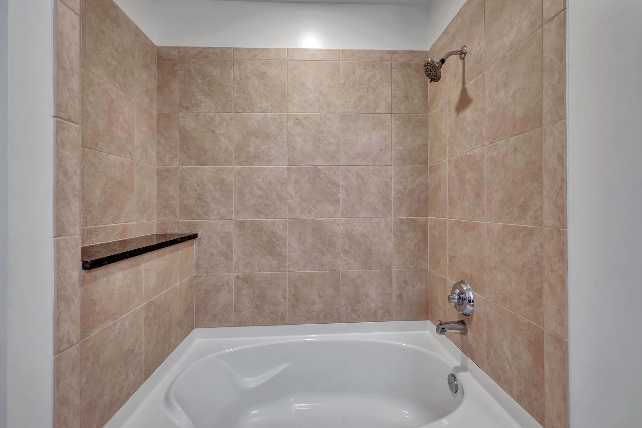 301 Demonbreun Street, Unit 1120 Nashville, TN 37201 - Photo 28 of 51 a bathroom with a tub