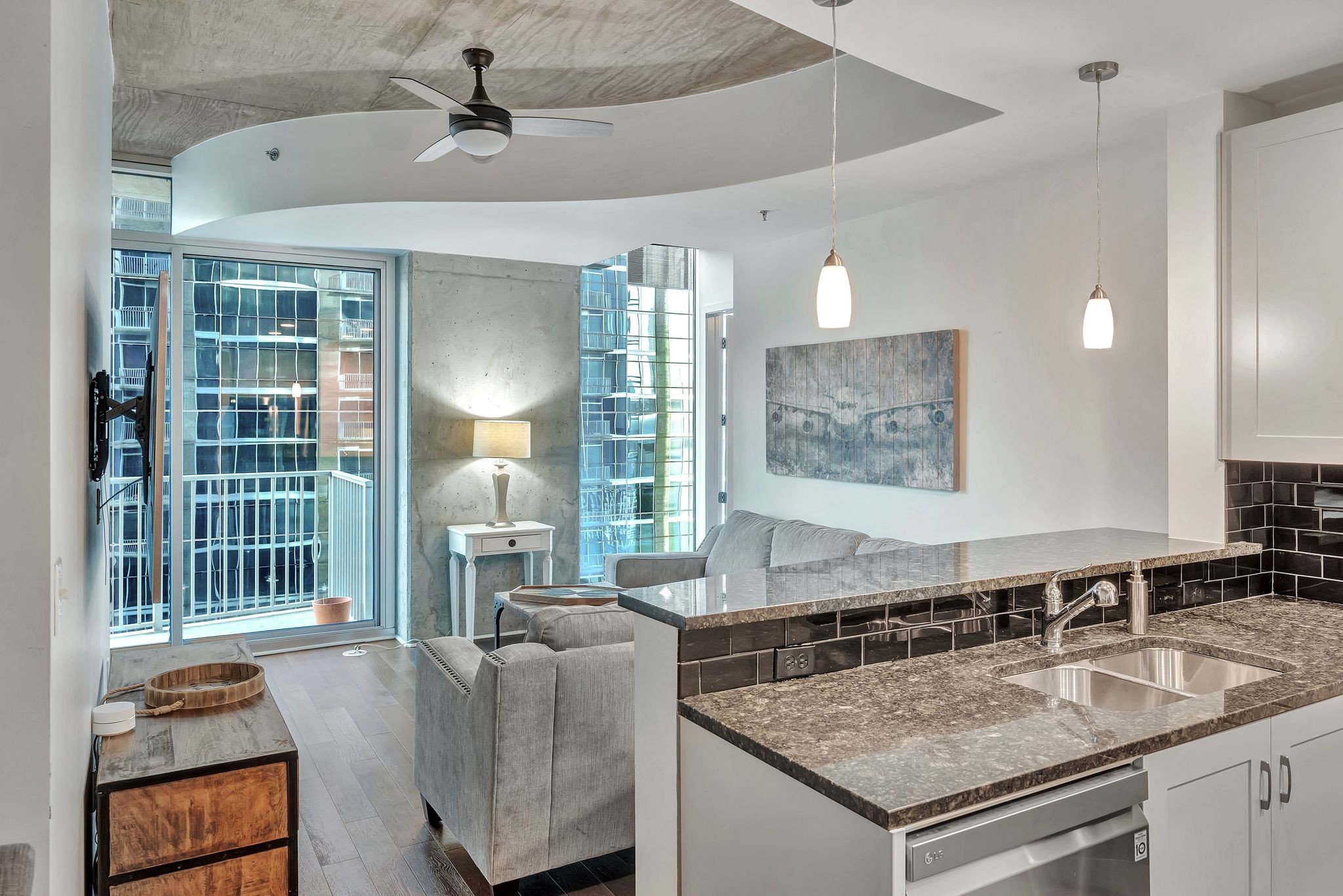 301 Demonbreun Street, Unit 1120 Nashville, TN 37201 - Photo 3 of 51 a living room with furniture and a window