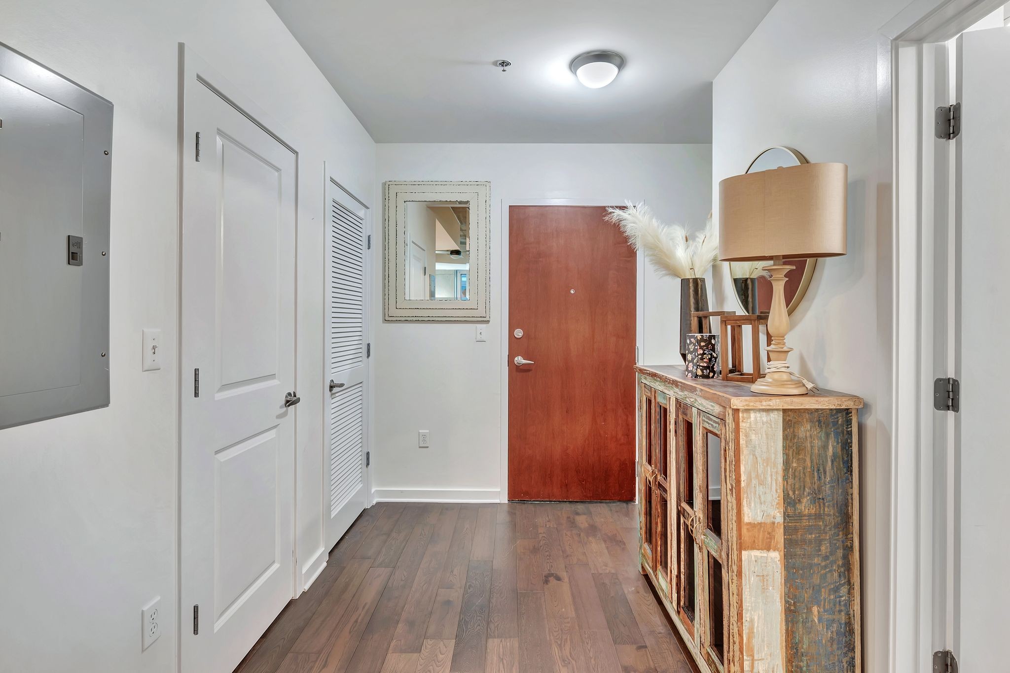301 Demonbreun Street, Unit 1120 Nashville, TN 37201 - Photo 5 of 51 a view of a hallway with wooden floor and staircase
