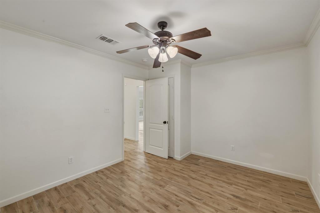 353 Deer Creek Road Big Sandy, TX 75755 - Photo 12 of 25 a view of an empty room with wooden floor