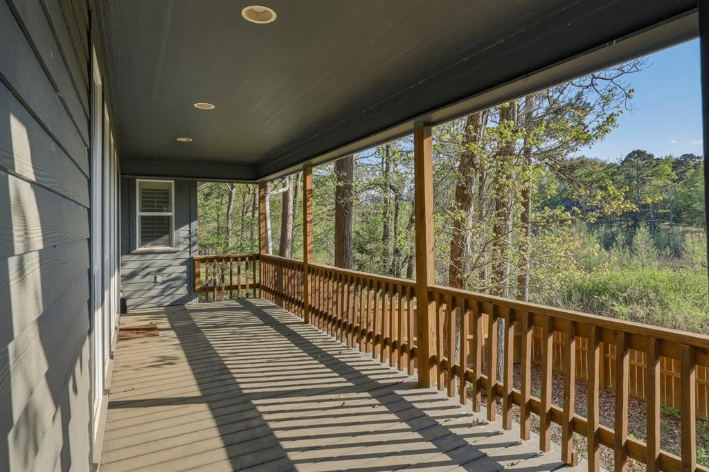 353 Deer Creek Road Big Sandy, TX 75755 - Photo 16 of 25 a view of a balcony with wooden floor