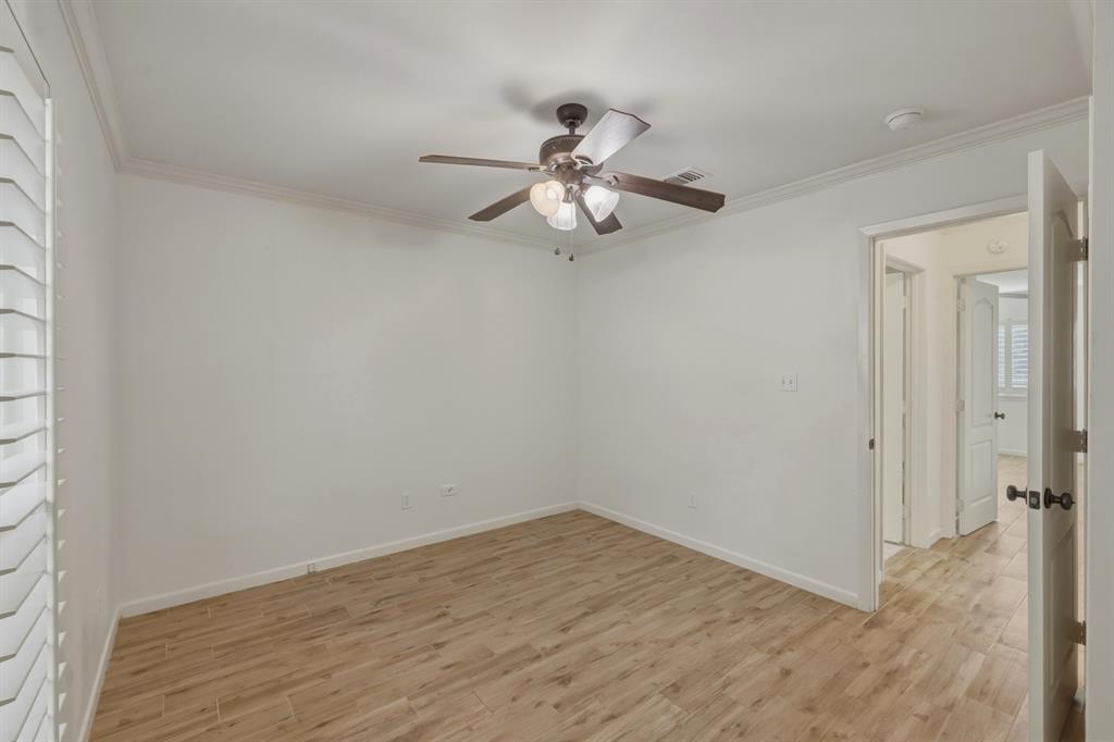 353 Deer Creek Road Big Sandy, TX 75755 - Photo 17 of 25 a view of a workspace with wooden floor and a chandelier fan