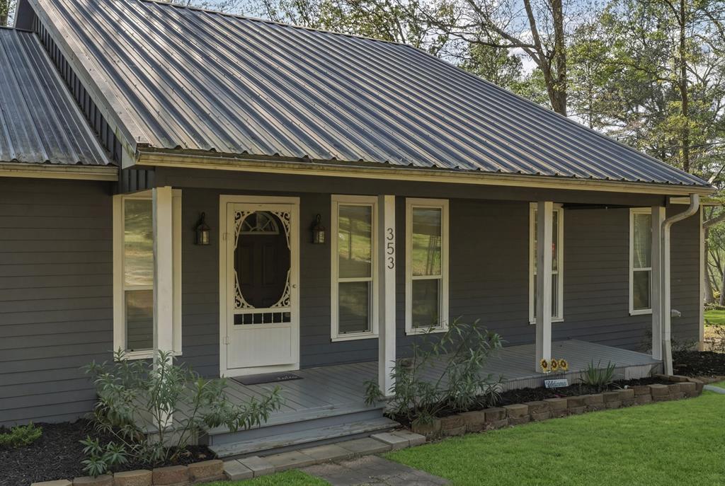 353 Deer Creek Road Big Sandy, TX 75755 - Photo 2 of 25 a front view of a house with garden
