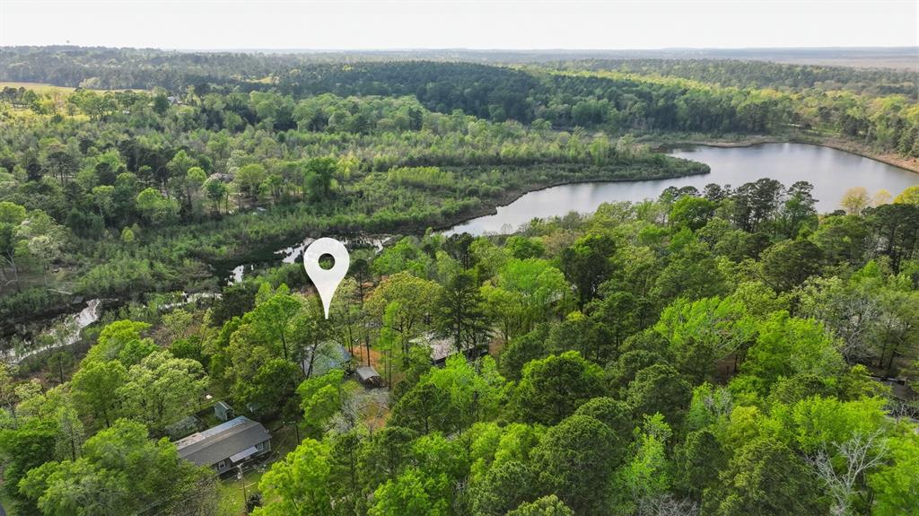 353 Deer Creek Road Big Sandy, TX 75755 - Photo 23 of 25 an aerial view of a house with a yard and lake view