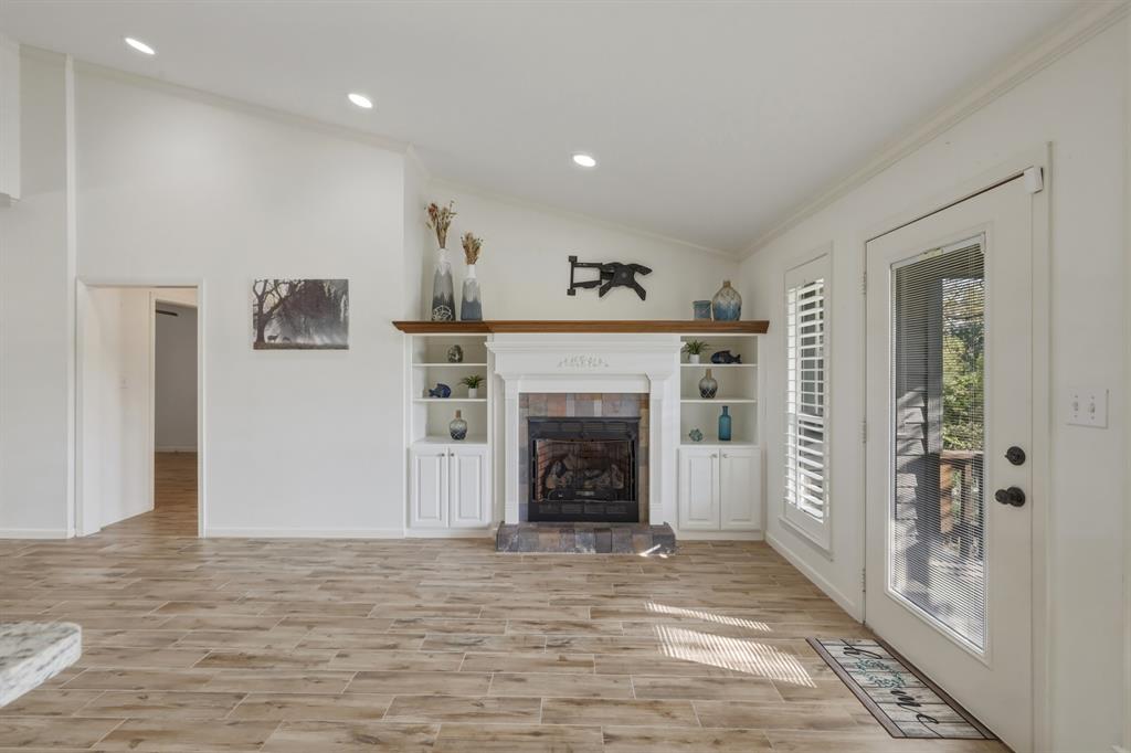 353 Deer Creek Road Big Sandy, TX 75755 - Photo 3 of 25 a view of a livingroom with an empty space and a fireplace