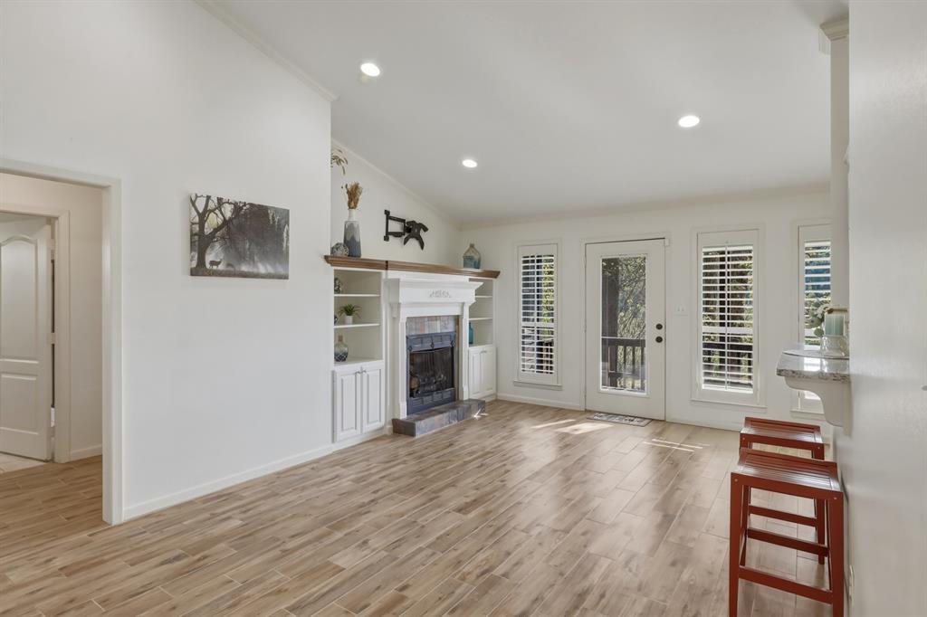 353 Deer Creek Road Big Sandy, TX 75755 - Photo 4 of 25 wooden floor in an empty room with a fireplace