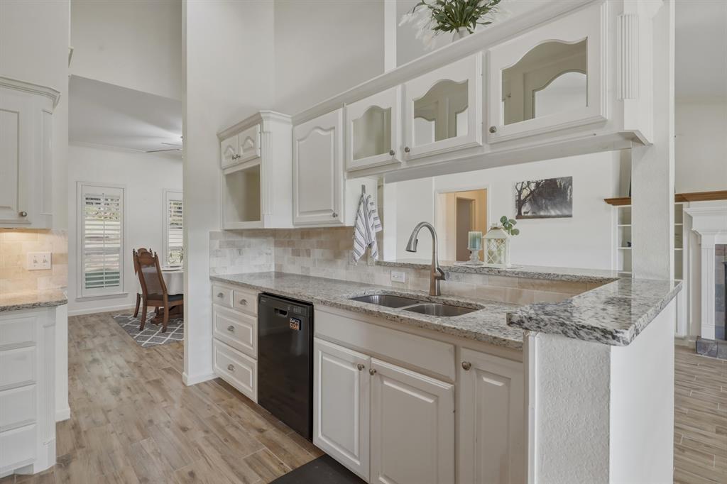 353 Deer Creek Road Big Sandy, TX 75755 - Photo 7 of 25 a kitchen with stainless steel appliances granite countertop a sink and cabinets
