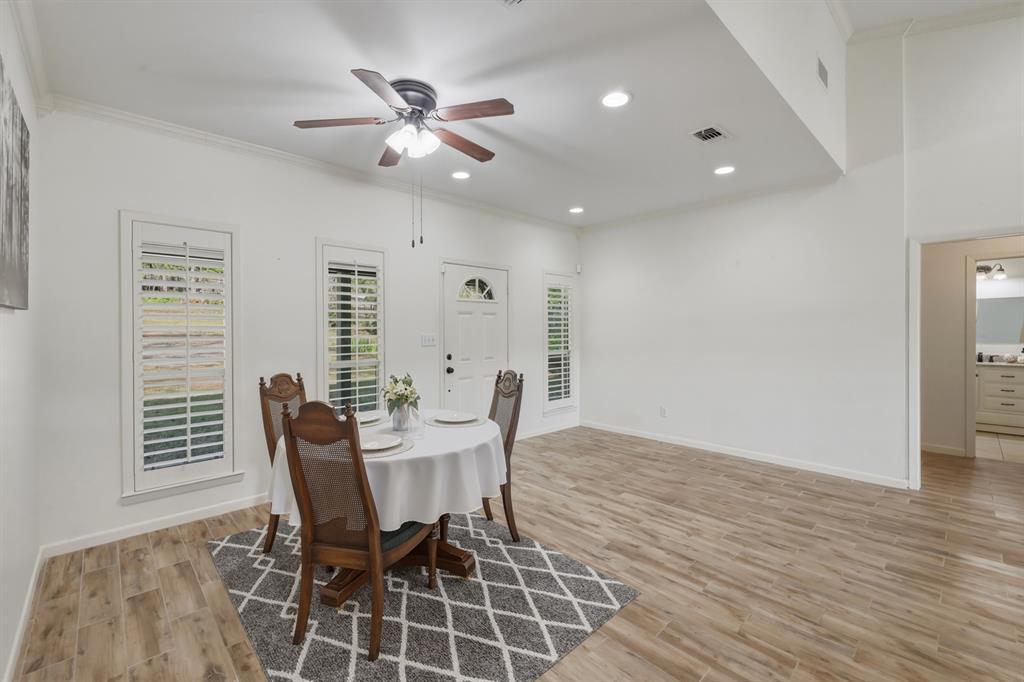 353 Deer Creek Road Big Sandy, TX 75755 - Photo 10 of 25 a view of a dining room with furniture and wooden floor