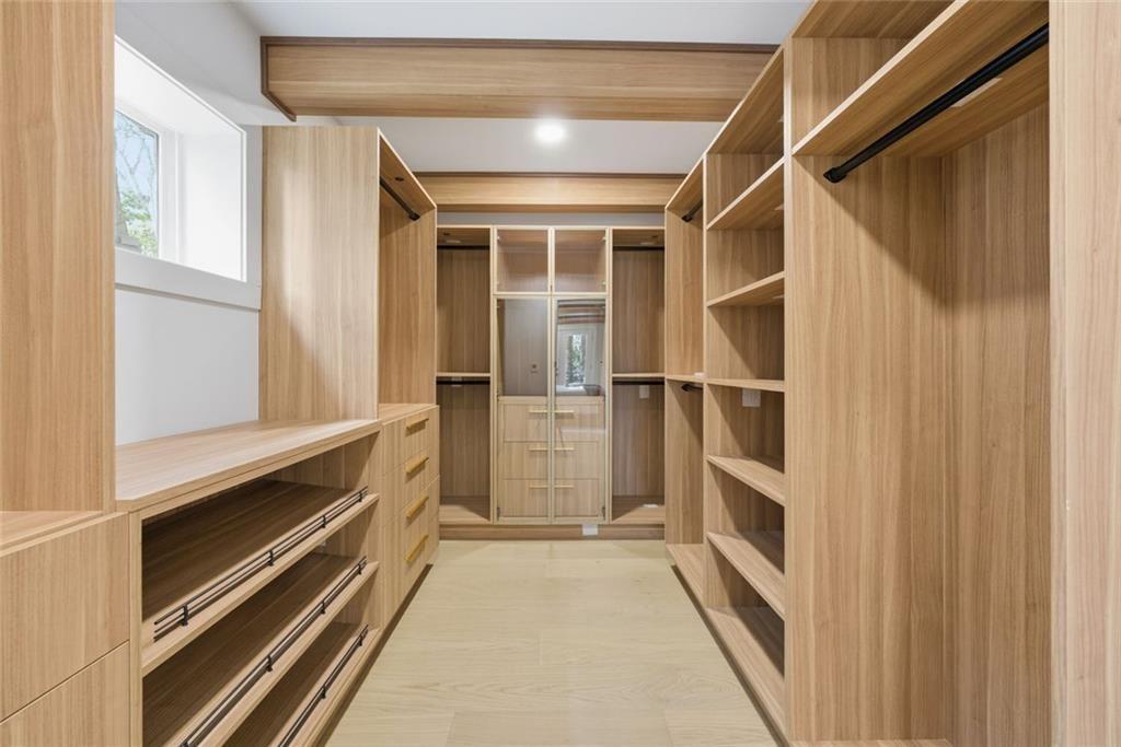 1253 Brooklawn Road Northeast Brookhaven, GA 30319 - Photo 18 of 55 a view of walk in closet with empty racks