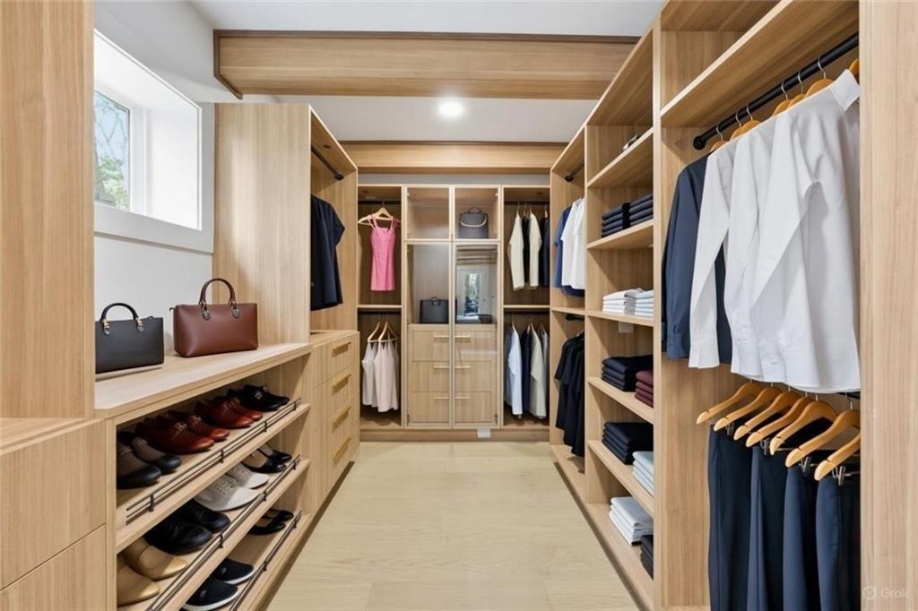 1253 Brooklawn Road Northeast Brookhaven, GA 30319 - Photo 19 of 55 a view of walk in closet with clothes and shoes