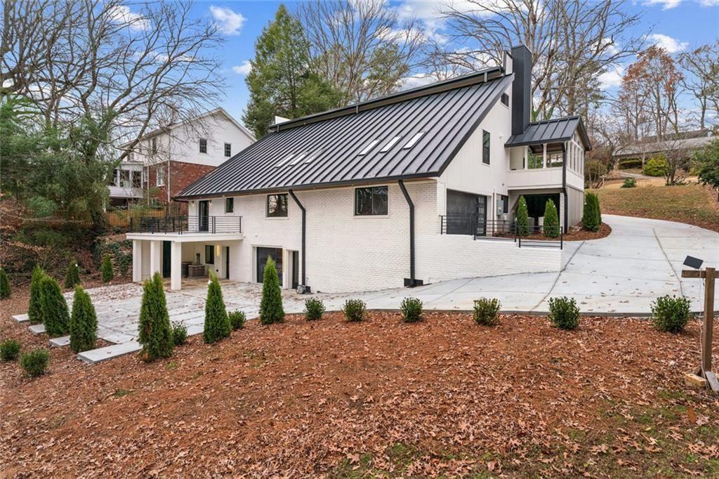 1253 Brooklawn Road Northeast Brookhaven, GA 30319 - Photo 52 of 55 a front view of a house with a yard