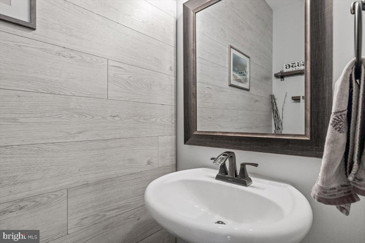 217 Morlyn Drive Stephenson, VA 22656 - Photo 14 of 35 a bathroom with a sink and mirror
